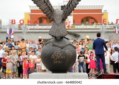 Orel, Russia - August 03, 2016: Eagle Statue Opening Ceremony. Crowd Of People Around Bronze Eagle On Globe