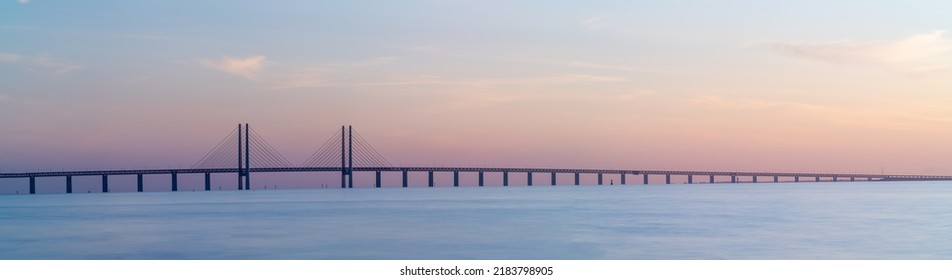 The Oresund Bridge is a combined motorway and railway bridge between Sweden and Denmark (Malmo and Copenhagen). Long exposure. Selective focus. - Shutterstock ID 2183798905