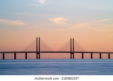 The Oresund Bridge is a combined motorway and railway bridge between Sweden and Denmark (Malmo and Copenhagen). Long exposure. Selective focus. - Shutterstock ID 2183802107