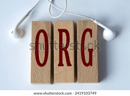 ORG ( - acronym on an external drive in gray letters on the background of a laptop. Info concept