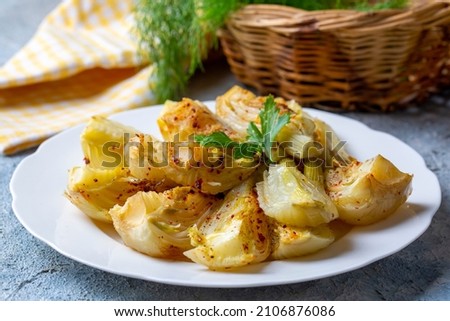 Organic Baked Fennel Bulbs with Salt and Pepper. Fennel dish with olive oil.