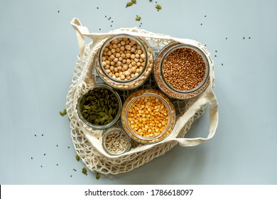 Organic Bio Bulk Products In Zero Waste Shop. Foods Storage In Kitchen At Low Waste Lifestyle. Cereals And Grains In Glass Jars On Table. Eco Friendly Shopping In Plastic Free Grocery Store.