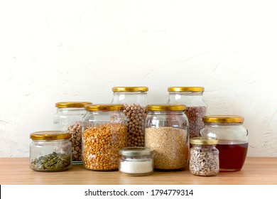 Organic Bio Bulk Products In Zero Waste Shop. Foods Storage In Kitchen At Low Waste Lifestyle. Cereals And Grains In Glass Jars On Table. Eco Friendly Shopping In Plastic Free Grocery Store.