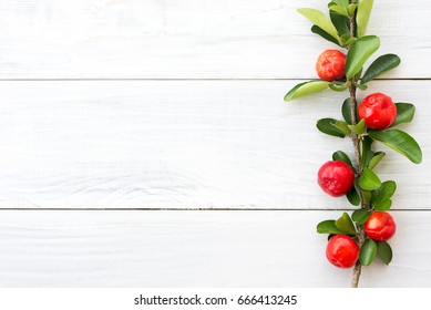 Organic Brazilian Acerola Cherry On White Wooden Table