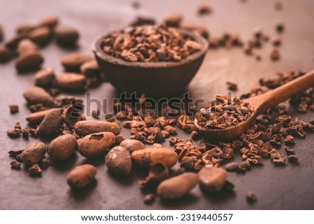 Organic cacao beans and nibs in small bowl 