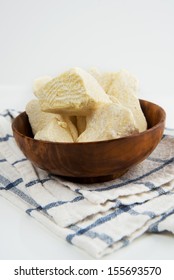 Organic Cacao Butter In Chunks In Wooden Bowl