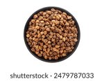 Organic Chickpeas ( Cicer arietinum) or Kala Chana, in a black ceramic bowl. Isolated on a white background. Top View