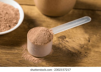 Organic Chocolate Whey Protein Powder in a Scoop