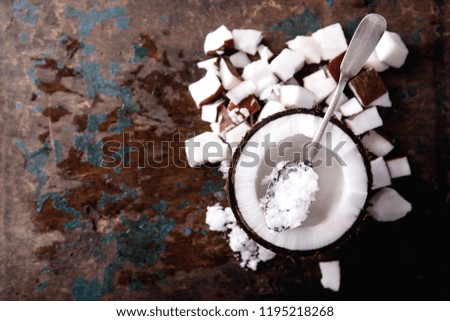 Similar – Image, Stock Photo Coconut oil in wooden bowl with spoon and moisturizing cream