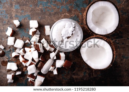 Similar – Image, Stock Photo Coconut oil in wooden bowl with spoon and moisturizing cream