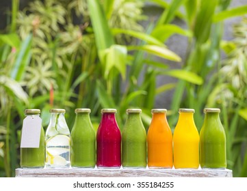 Organic cold-pressed raw vegetable juices in glass bottles