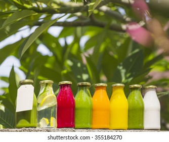 Organic cold-pressed raw vegetable juices in glass bottles