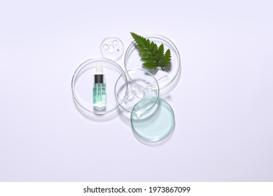 Organic Cosmetic Product, Natural Ingredient And Laboratory Glassware On White Background, Top View