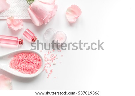 organic cosmetic with rose oil on white background top view
