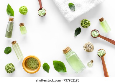 Organic Cosmetic Set With Tea Olive Oil And Sea Salt In Bottle White Table Background Flat Lay Frame Mockup