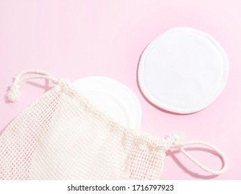 Organic Cotton Pads With String Bag On Pink Background. Zero Waste, Reusable, Eco, Makeup Remover And Washing Concept. Pattern, Hard Light, Flat Lay, Close Up