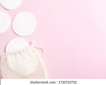 Organic Cotton Pads With String Bag On Pink Background. Zero Waste, Reusable, Eco, Makeup Remover And Washing Concept. Pattern, Hard Light, Flat Lay, Copyspace