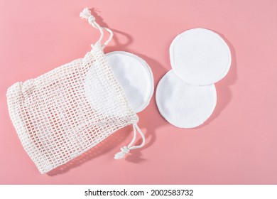 Organic Cotton Pads With String Bag On Pink Background. Zero Waste, Reusable, Eco, Makeup Remover. Shadows, Hard Light, Flat Lay