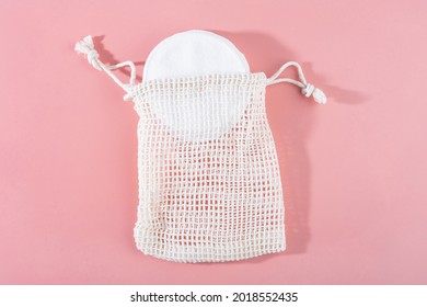 Organic Cotton Pads With String Bag On Pink Background. Zero Waste, Reusable, Eco, Makeup Remover. Shadows, Hard Light, Flat Lay