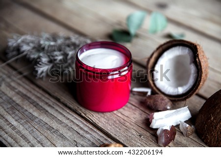 Organic cream on wooden background. Conditioner, shampoo for hair care. Natural cosmetics. Healthy skin and hair.