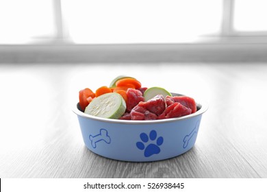 Organic Dog Food In A Bowl On A Wooden Floor