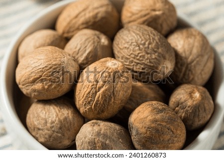 Organic Dry Whole Nutmeg in a Bowl