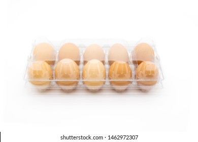 Organic eggs in transparent package, on white background. Freshly packaged organic egg packs