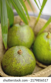 Organic farm avocado in straw basket on wooden table closeup. Fresh ripe green exotic fruits full of healthy nutriment vegetarian eating. Three tropical edible plant with twig for guacamole cooking - Shutterstock ID 2179856517