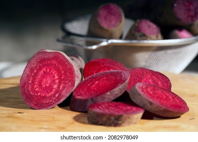Organic farming. Beetroot 'Cilindra' and slices on a white background. Root vegetables from the garden on a white table. - Shutterstock ID 2082978049