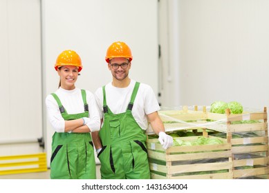 Organic Farming Concept. Portrait Of A Happy Workers At Organic Food Distribution Center.