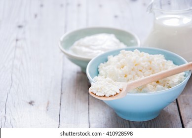 Organic Farming Cottage Cheese In A Blue Bowl, Sour Cream And Milk