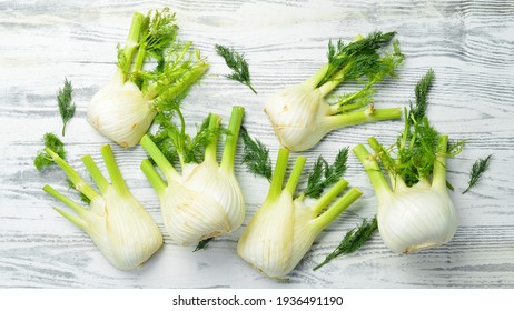 Organic fennel on a white wooden background. Healthy food. Top view. Free space for your text.