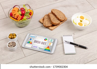 Organic food and tablet pc showing DASH DIET inscription, healthy nutrition composition - Shutterstock ID 1739002304