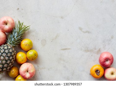 Organic fresh fruits frame on a gray concrete background, clean eating concept. Top view, copy space - Powered by Shutterstock