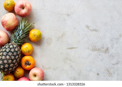 Organic fresh fruits frame on a gray concrete background, clean eating concept. Top view, copy space - Powered by Shutterstock