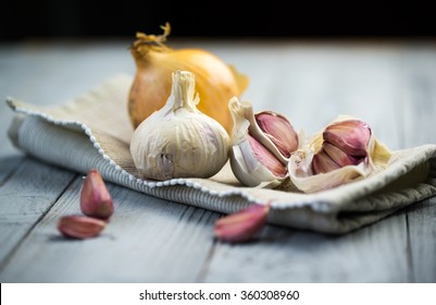 Organic Garlic And Onion On Wooden Background