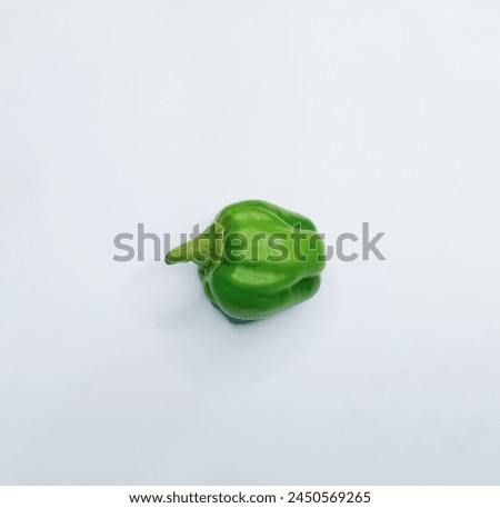 Organic Green bell pepper isolated on white background, side view
