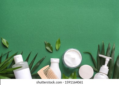 Organic Hair Care Products With Green Leaves On Green Background, Trendy Layout, Eco Beauty And Healthy Lifestyle Concept.