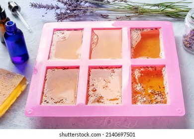 Organic Handmade Soap. Diy Cosmetics, The Process Of Making. Liquid Glycerin Base With Essential Oils And Lavender In A Silicone Mold