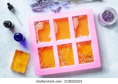 Organic Handmade Soap, Overhead Flat Lay Shot. Diy Cosmetics, The Process Of Making. Liquid Glycerin With Essential Oils And Lavender Buds In A Silicone Soap Mold