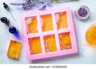 Organic Handmade Soap, The Process Of Making, Overhead Flat Lay Shot. Liquid Glycerin With Lavender Flower Buds And Essential Oils In A Mold, To Later Form Solid Bars