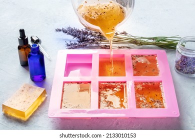 Organic Handmade Soapmaking. Diy Cosmetic, The Process Of Making. Liquid Glycerin With Essential Oils And Lavender Buds Is Poured Into A Silicone Soap Mold