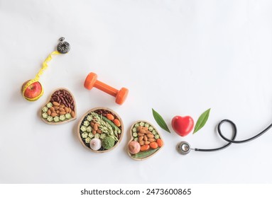 Organic  healthy  food  in  wooden  bowls ,medical  stethoscope  red heart  shape ,dumbbell and tape  measure  wrapped  around  the apple  on  white background  for  the  health  concept,Top  view. - Powered by Shutterstock