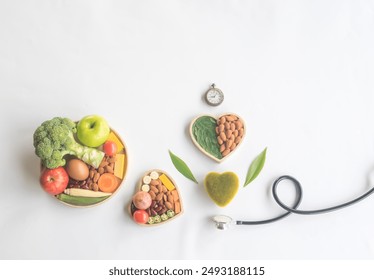 Organic  healthy  food  in  wooden  bowls,medical  stethoscope  and  green heart  shape  on  white backgound  for  the  health  concept.Top  view. - Powered by Shutterstock