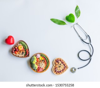 Organic  Healthy  Food,fruits,vegetables  In  Wooden  Bowl,stethoscope,red,green  Heart  Shape  And  Leave  Herb  On  White  Background  For  Creative  Healthcare  And  Ecology  Concept