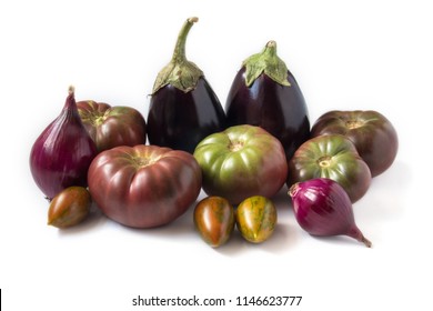 Organic Heirloom Tomatoes, Eggplants, And Sweet Onions, Isolated On White