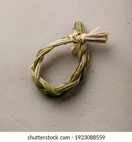 Organic herbal Incense Sweet grass on gray concrete background