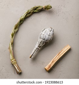 Organic herbal Incense Sweet grass, White sage and Palo santo stick on gray concrete background