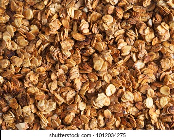 Organic homemade Granola Cereal with oats and almond. Texture oatmeal granola or muesli as background. Top view or flat-lay. Copy space for text.