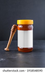 Organic honey with wooden honey dripper